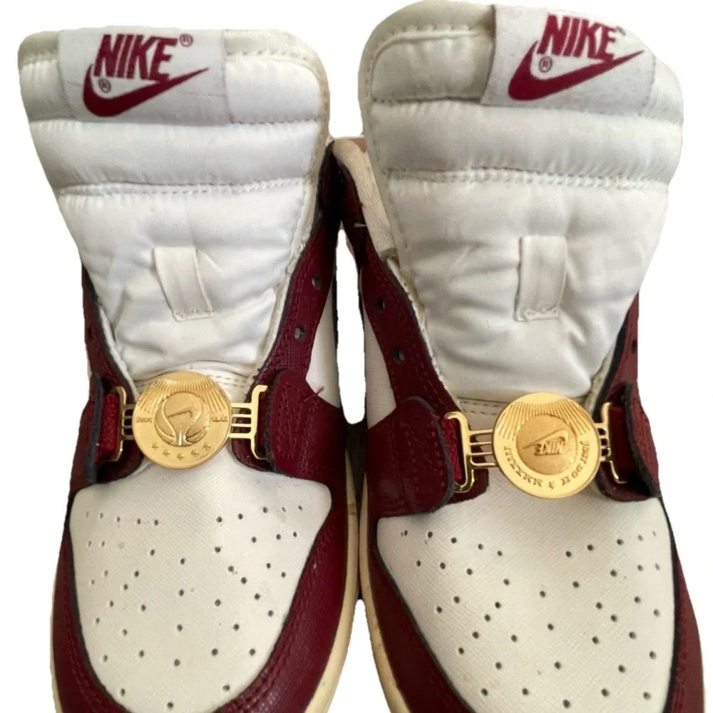 Nike Women’s White and Burgundy Sneakers with Gold Accents